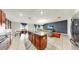 Open concept kitchen seamlessly flowing into the dining and living areas, perfect for entertaining and Gathering gatherings at 17136 Sunshine Mimosa: St, Wimauma, FL 33598