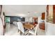 Spacious living room seamlessly connected to dining and kitchen areas, creating an inviting open-concept layout at 17136 Sunshine Mimosa: St, Wimauma, FL 33598