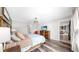 Main bedroom with hardwood floors, closet door, and bright, airy feel at 17136 Sunshine Mimosa: St, Wimauma, FL 33598