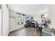 Office with multiple workstations, natural light from the window, and modern decor to promote productivity at 17136 Sunshine Mimosa: St, Wimauma, FL 33598
