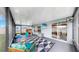 Relaxing screened patio featuring a patterned rug, playset, and outdoor ceiling fans at 17136 Sunshine Mimosa: St, Wimauma, FL 33598