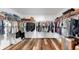 Walk-in closet with organized shelving, hanging racks, and hardwood flooring at 17136 Sunshine Mimosa: St, Wimauma, FL 33598