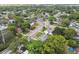 Aerial shot of a residential area, showcasing houses with green trees and well-maintained streets at 1807 E Bougainvillea Ave, Tampa, FL 33612