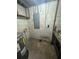 A basement utility room with an electric panel and a workbench at 1807 E Bougainvillea Ave, Tampa, FL 33612