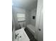 Bright bathroom featuring a tub with a stylish tiled wall and a modern sink at 1807 E Bougainvillea Ave, Tampa, FL 33612