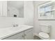 Bright bathroom features modern vanity, and tiled shower with window providing ample natural light at 1807 E Bougainvillea Ave, Tampa, FL 33612