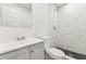 A renovated bathroom features tile floors, new fixtures, and a tile shower at 1807 E Bougainvillea Ave, Tampa, FL 33612