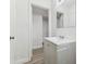 Bathroom featuring a gray vanity with a white sink top at 1807 E Bougainvillea Ave, Tampa, FL 33612