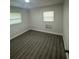 Bright bedroom with new floors and paint has natural light at 1807 E Bougainvillea Ave, Tampa, FL 33612