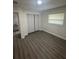 This bedroom has new floors, paint, closet and natural light at 1807 E Bougainvillea Ave, Tampa, FL 33612