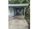 This is a car port attached to a home. It is adjacent to the front door at 1807 E Bougainvillea Ave, Tampa, FL 33612