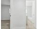 Hallway featuring durable flooring connecting the bedroom and bathroom at 1807 E Bougainvillea Ave, Tampa, FL 33612