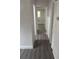 Hallway with new paint and floors leads to other rooms at 1807 E Bougainvillea Ave, Tampa, FL 33612