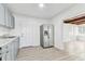 Spacious kitchen features gray cabinets, stainless steel appliances, and an open view to the living room at 1807 E Bougainvillea Ave, Tampa, FL 33612