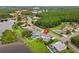 Aerial view of home with a pool and access to a lake at 18219 Bittern Ave, Lutz, FL 33558