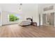 Spacious bedroom with vinyl flooring and ample natural light from a large window at 18219 Bittern Ave, Lutz, FL 33558