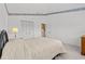 Bedroom with neutral walls, carpet, a queen bed, and a closet for storage at 18219 Bittern Ave, Lutz, FL 33558