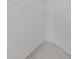 A walk-in closet with a white shelf providing ample storage space at 18219 Bittern Ave, Lutz, FL 33558