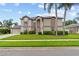 Charming two-story home with a well-manicured lawn and lush landscaping at 18219 Bittern Ave, Lutz, FL 33558