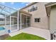 Exterior view of home with screened-in patio and ADT security sign at 18219 Bittern Ave, Lutz, FL 33558