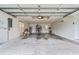Spacious garage with ample storage shelves and a clean, well-maintained floor at 18219 Bittern Ave, Lutz, FL 33558