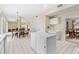 Spacious kitchen features an island, white cabinets, and adjacent dining area at 18219 Bittern Ave, Lutz, FL 33558
