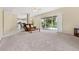 Expansive living room with sliding glass doors leading to the pool and patio at 18219 Bittern Ave, Lutz, FL 33558