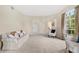 Comfortable living room featuring neutral colors, soft carpet, and abundant natural light at 18219 Bittern Ave, Lutz, FL 33558