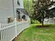 Backyard space featuring a white picket fence, landscaping and view of neighbors at 2015 Vista Del Sol # 108, Lutz, FL 33558