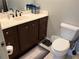 Bathroom with wooden vanity and toilet at 2015 Vista Del Sol # 108, Lutz, FL 33558