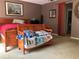 Cozy bedroom featuring a wooden bed frame, wood flooring and neutral walls at 2015 Vista Del Sol # 108, Lutz, FL 33558