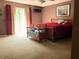 Cozy bedroom with a bed and sliding glass door leading to the outside at 2015 Vista Del Sol # 108, Lutz, FL 33558