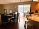 View of the dining area, extending to the outdoor patio through sliding glass doors at 2015 Vista Del Sol # 108, Lutz, FL 33558