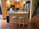 Kitchen with an island, stainless steel appliances, and breakfast bar at 2015 Vista Del Sol # 108, Lutz, FL 33558