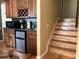 Kitchenette featuring wood cabinets, countertop, microwave, and mini-refrigerator at 2015 Vista Del Sol # 108, Lutz, FL 33558