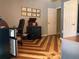 Office space with unique wood flooring and a refrigerator at 2015 Vista Del Sol # 108, Lutz, FL 33558
