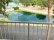 Community pond with fountain seen from a balcony at 2015 Vista Del Sol # 108, Lutz, FL 33558