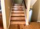 Wooden staircase with a light colored wood at 2015 Vista Del Sol # 108, Lutz, FL 33558