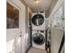 Bright laundry room with stacked washer and dryer units and ample storage space at 216 W South Ave, Tampa, FL 33603