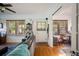Cozy living room features hardwood floors, plenty of natural light, and neutral paint, creating a warm and inviting atmosphere at 216 W South Ave, Tampa, FL 33603
