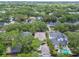 Aerial view of homes and neighborhood with lush green trees and landscaping at 2522 W Watrous Ave, Tampa, FL 33629