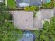 Birds eye view of a property showcasing the unique roof layout, yard and pool at 2522 W Watrous Ave, Tampa, FL 33629