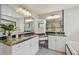 Bright bathroom featuring dual sinks and granite counters at 2522 W Watrous Ave, Tampa, FL 33629