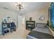 bedroom with a desk, bookshelf, twin bed, and neutral carpet at 2522 W Watrous Ave, Tampa, FL 33629