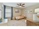 Cozy bedroom with neutral tones, plush rug, and a well-lit window, perfect for relaxation at 2522 W Watrous Ave, Tampa, FL 33629