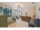 Stylish bedroom featuring a tranquil forest mural, window seat, and ample natural light at 2522 W Watrous Ave, Tampa, FL 33629