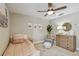 Inviting bedroom with warm colors, decorative mirror, and a comfortable chair for a cozy retreat at 2522 W Watrous Ave, Tampa, FL 33629