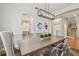 Modern dining room featuring a large table with seating, column accents and modern lighting at 2522 W Watrous Ave, Tampa, FL 33629