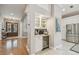 An entryway with wood floors, a wine fridge, and storage for coffee and bar accessories at 2522 W Watrous Ave, Tampa, FL 33629