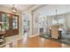 Welcoming foyer featuring wood floors, decorative columns, and access to the dining area at 2522 W Watrous Ave, Tampa, FL 33629